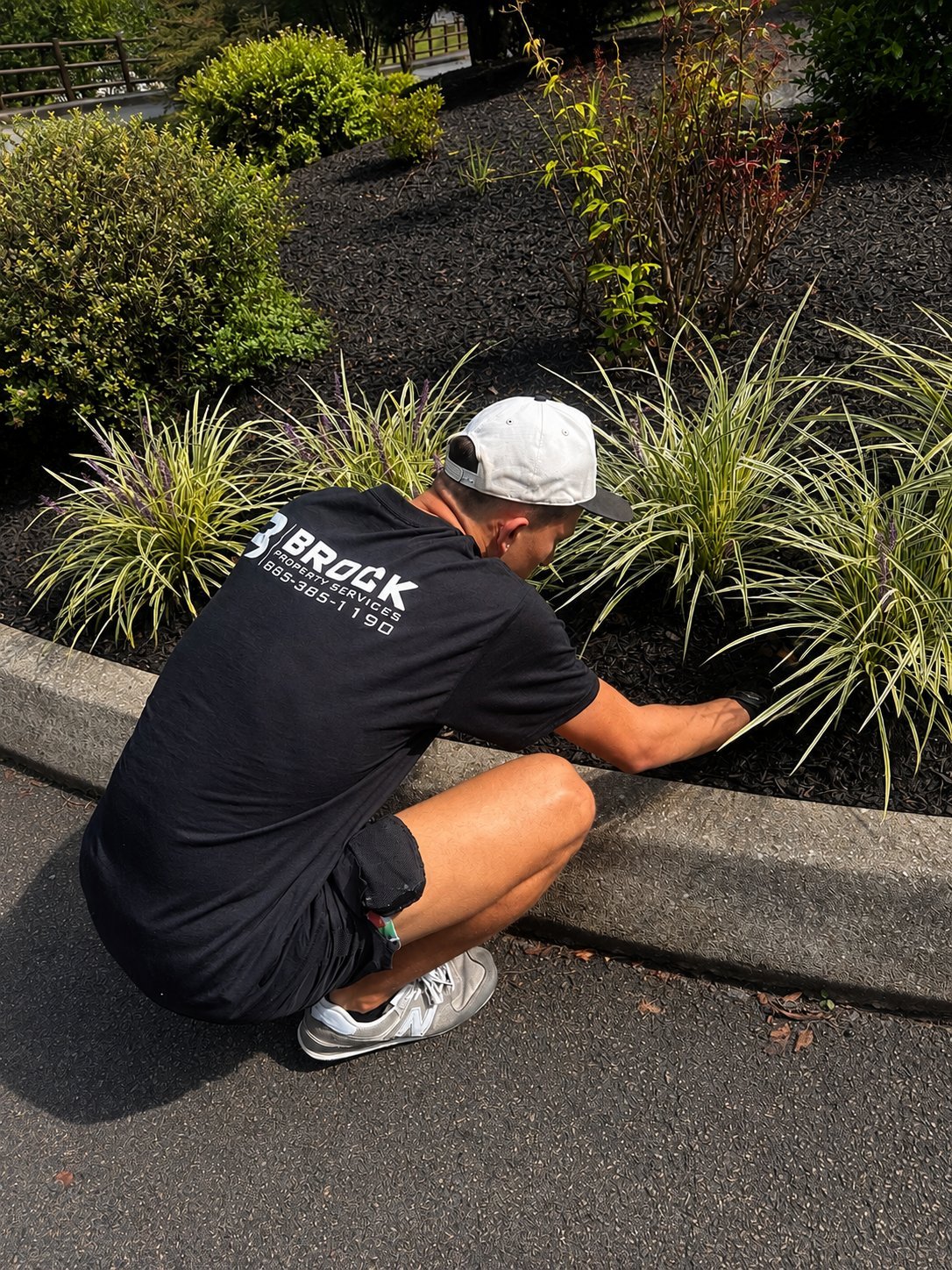 Property maintenance Sevierville, TN — Brock Property Services Crew performing landscaping and property maintenance in Sevierville, TN